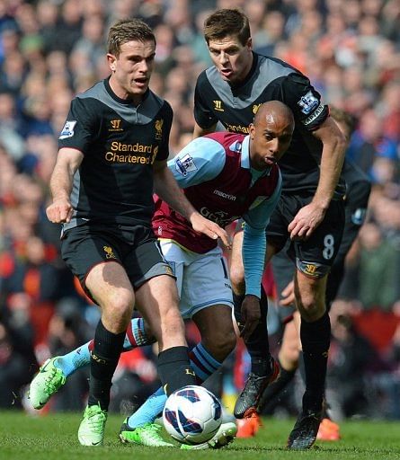 Aston Villa Fabian Delph (C) and Liverpool's Steven Gerrard (R) and Jordan Henderson are pictured on March 31, 2013